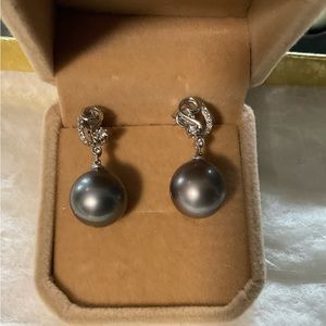 14k white gold South Sea Pearls. With small diamonds. Pearl size apex 12mm